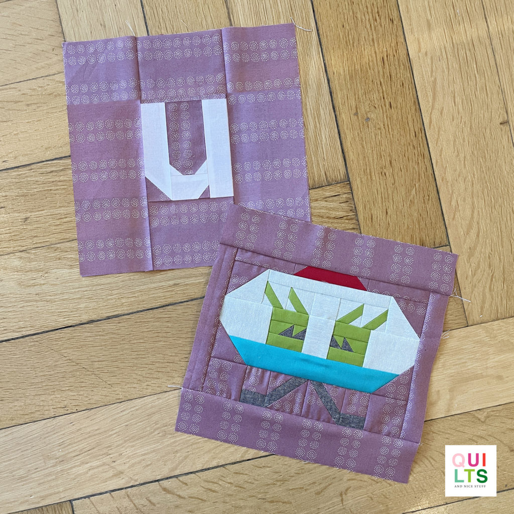 Letter-Vehicle Quilt letter block u und vehicle block ufo liegt auf Parkett 