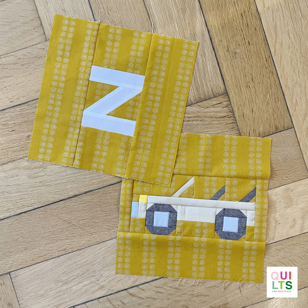 Letter-Vehicle Quilt letter block z und vehicle block zoo-safari mobile liegt auf Parkett