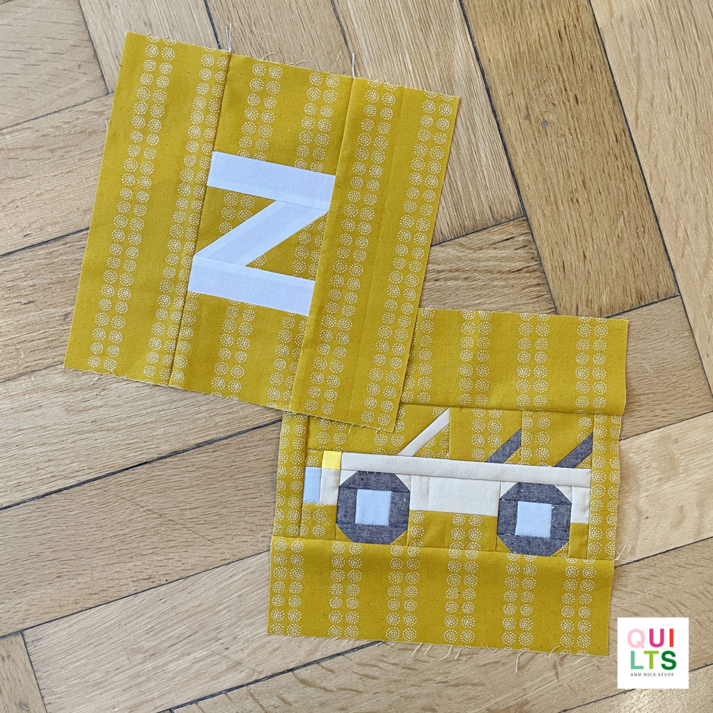 Letter-Vehicle Quilt letter block z und vehicle block zoo-safari mobile liegt auf Parkett 