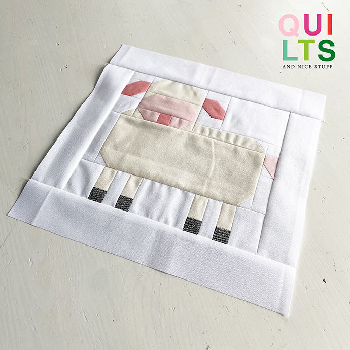 Lamm Quilt Block auf weißem Hintergrund